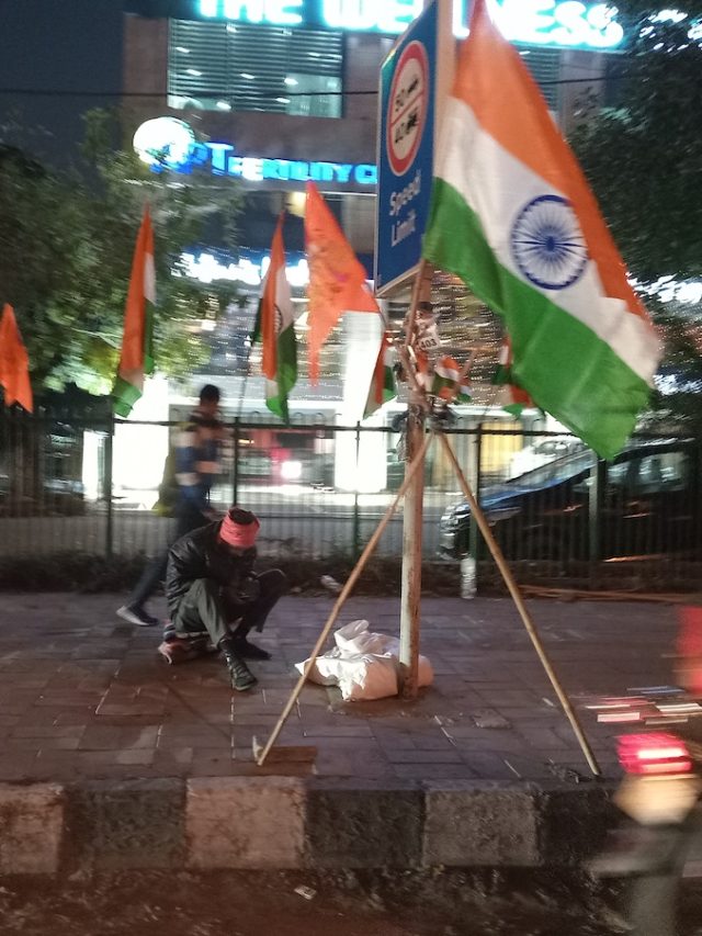 A man selling the Indian flag during Republic Day by Babra Shafiqi