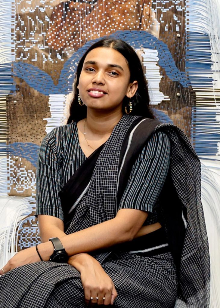 Picture of the artist Arpita Akhanda, infant of her artwork that won the prize