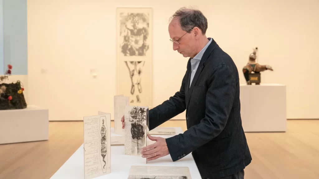 Christophe Cherix curating a MoMA exhibition