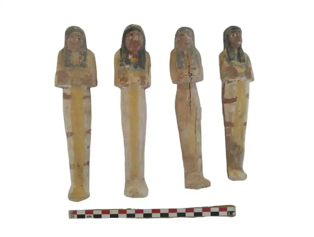 Several ancient artifacts, including these four figures, were found in the tombs. Courtesy - Egypt Ministry of Tourism and Antiquities (via AP)