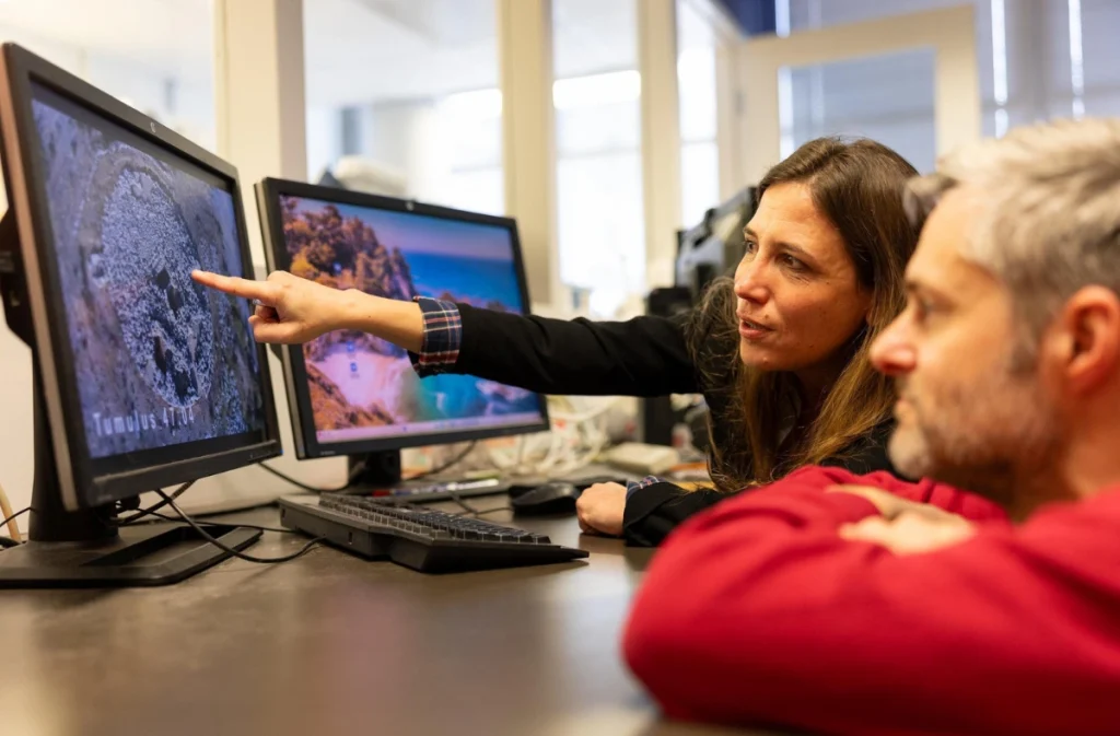University of Cincinnati Assistant Professor Florence Gaignerot-Driessen, left, consults with fabrication lab technician Jeffery Welch in UC's Rapid Prototyping Center. Courtesy - Andrew Hig