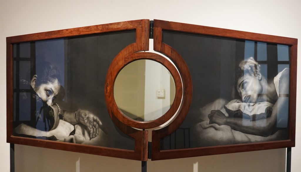 charcoal drawing in a wooden frame installation art 