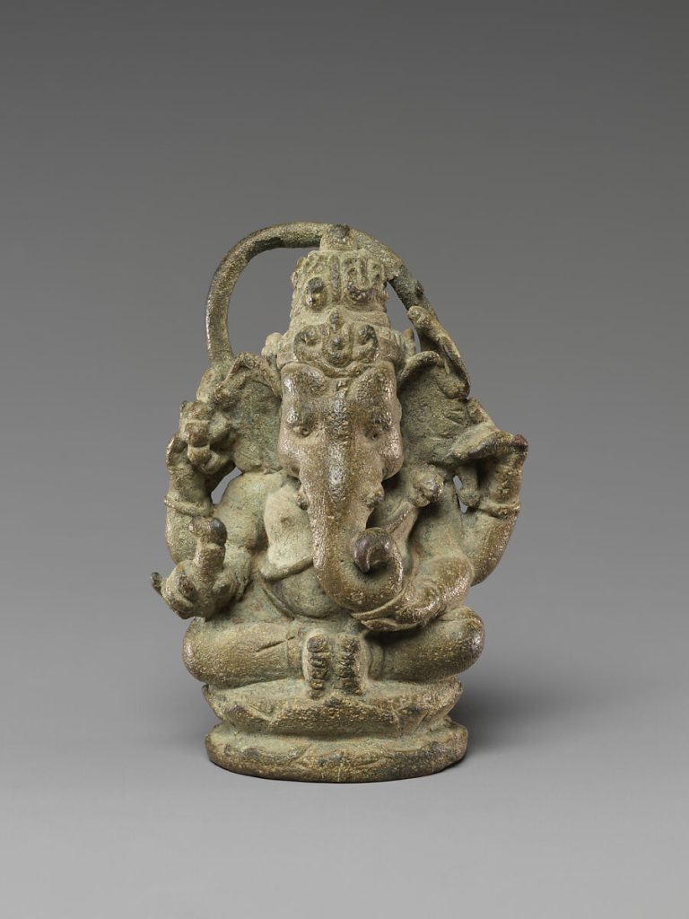 Sculpture depicting seated four-armed ganesha from Java, Indonesia