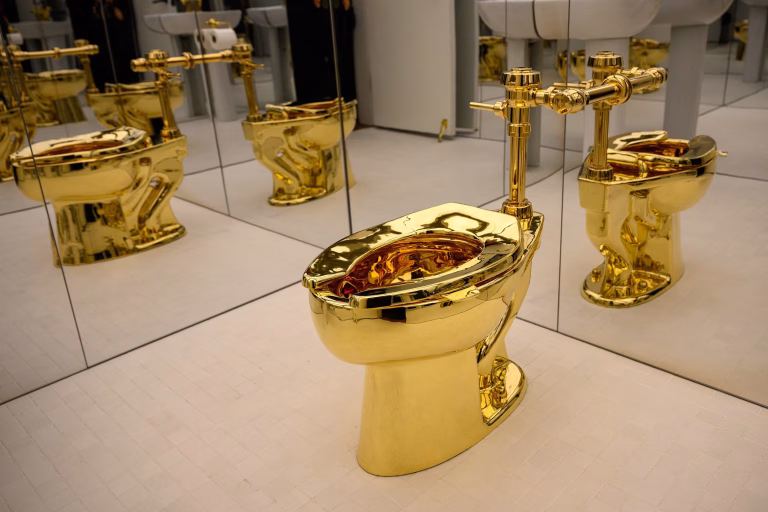 Maurizio Cattelan’s Gold Toilet Sells for $12.1 Million at Sotheby’s